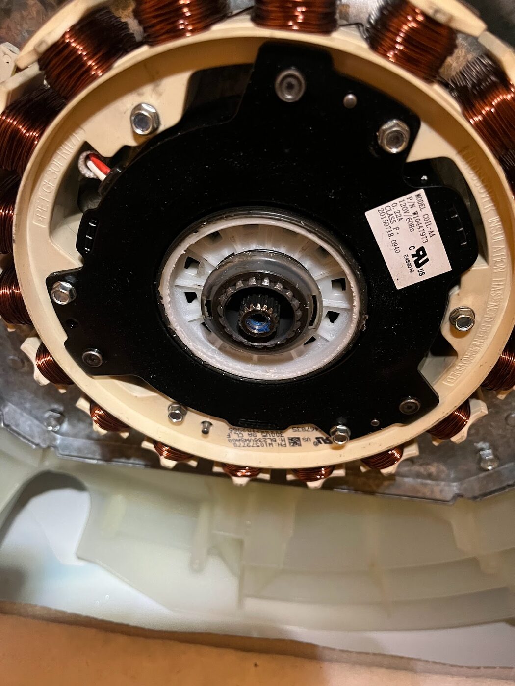 The internal motor of an appliance opened for repair